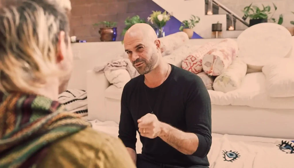 A therapist and practitioner receiving restorative energy work